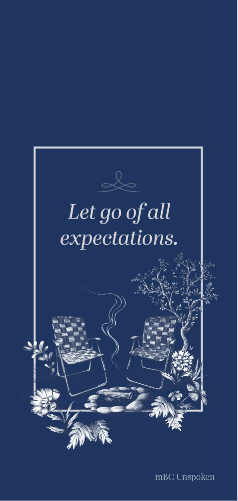 The phrase, “Let go of all expectations,” sits inside of a thin, white box on a navy-blue background. There is a hand-drawn illustration of two lawn chairs sitting in front of a fire pit. The fire has just gone out, so there is a thin trail of smoke coming from the logs in the fire pit.