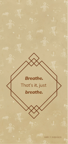 The phrase, “Breathe. That’s it, just breathe,” sits inside of a burnt orange geometric diamond that is set on a gold background.